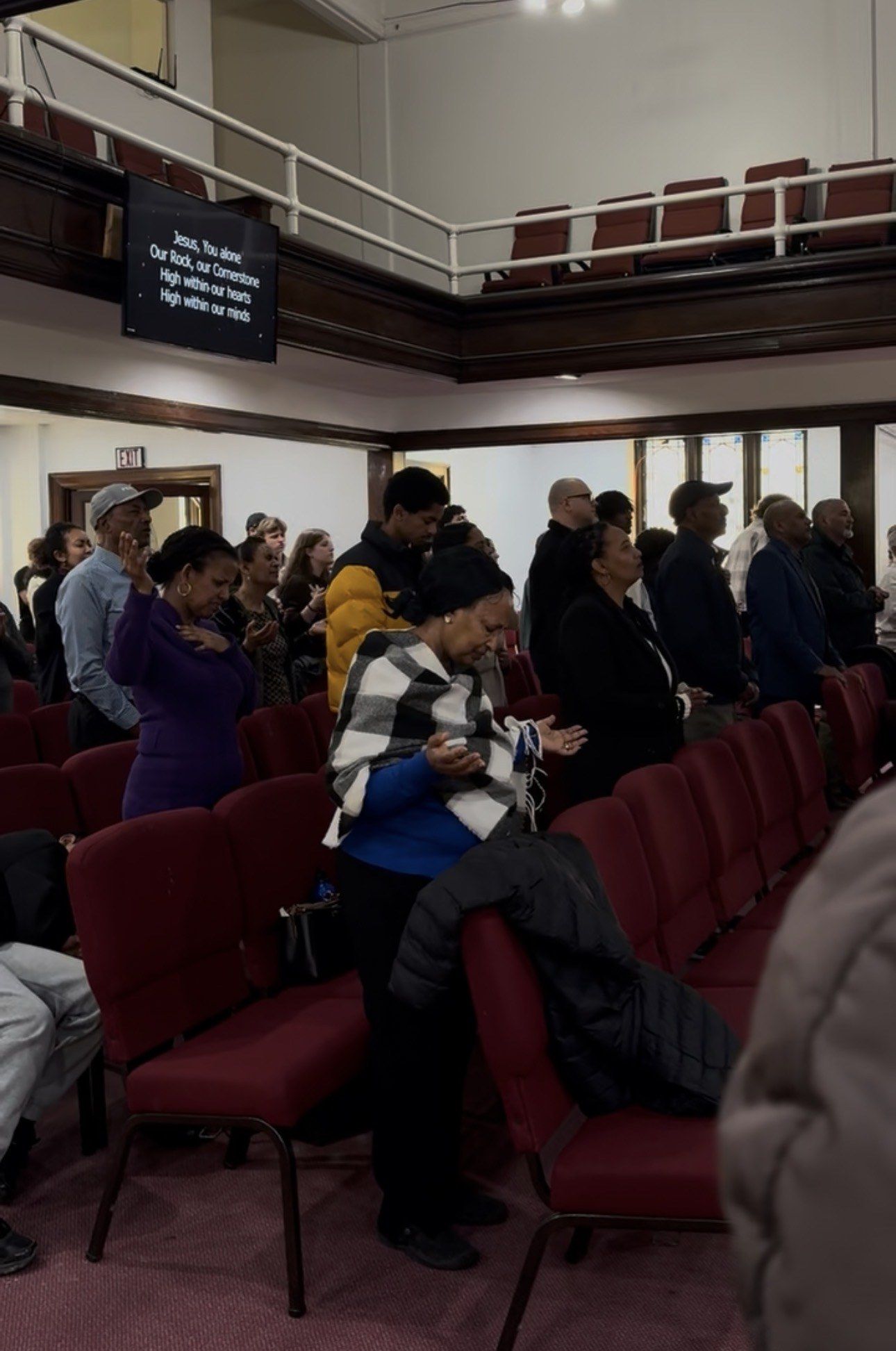 The congregation standing in worship